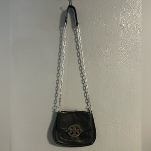Tory Burch black leather crossbody with chunky silver accents.